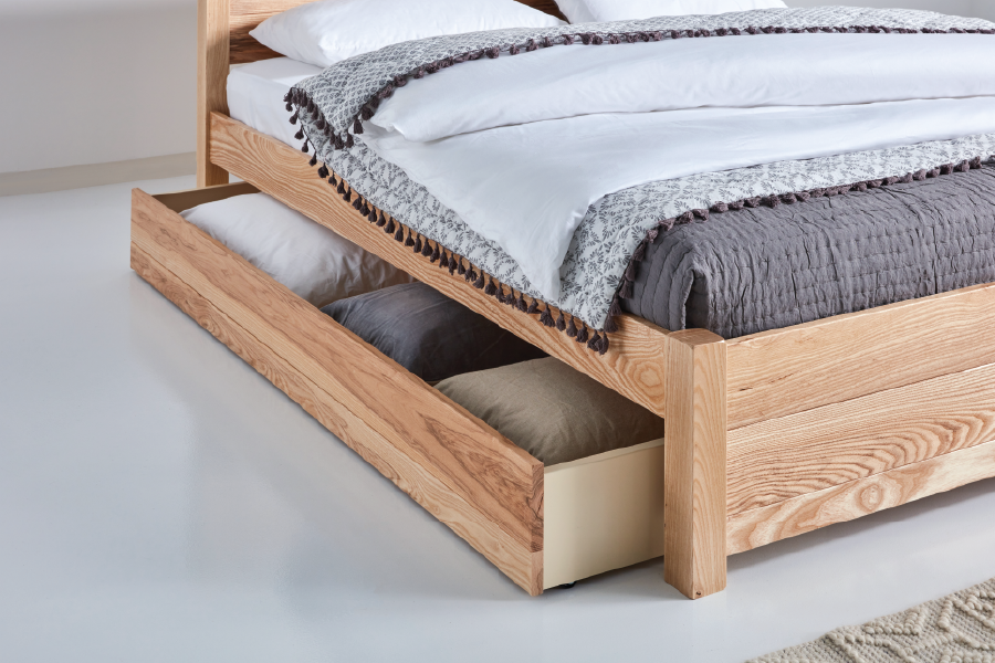 A bed with a drawer

Description automatically generated
