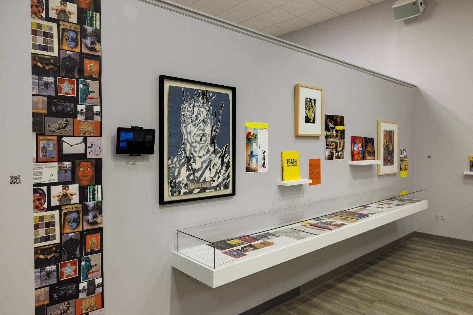 Image: Installation view of the Shadows Dance Within the Archive, What is Seen and Unseen: Mapping South Asian American Art in Chicago, South Asia Institute, 2024. The image shows ephemera in vitrines and printed archival collateral on the wall. Courtesy: South Asia Institute and Pratyush Swarap. 