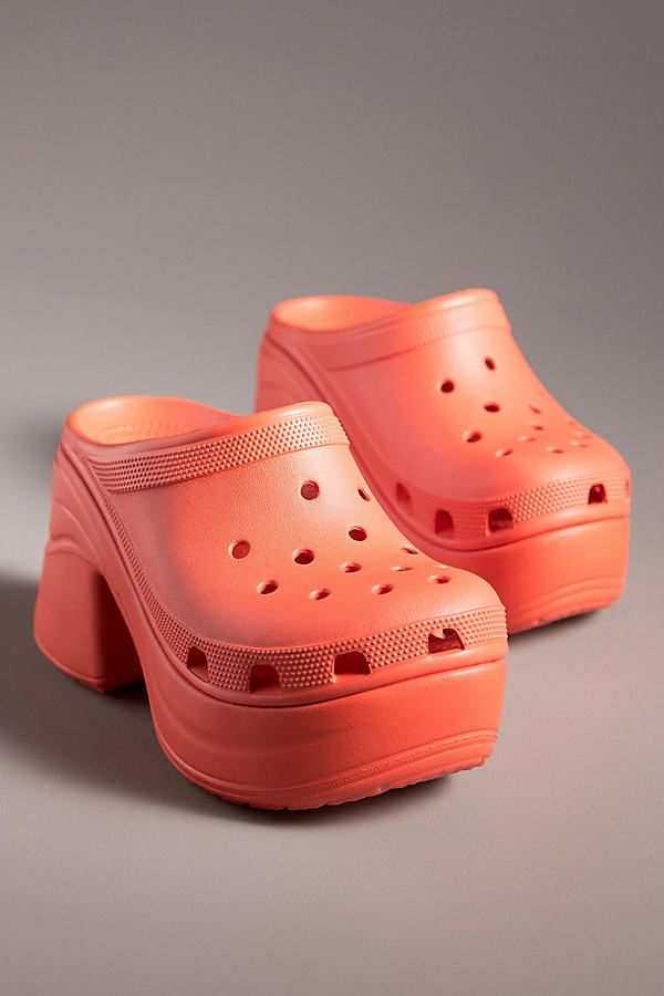 orange high-heeled clogs