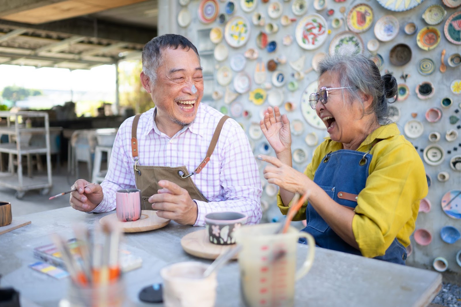 A resident engaged in stimulating activities such as art.