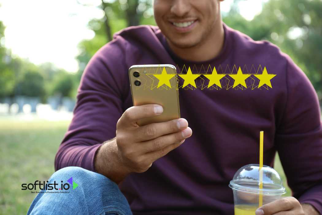 Man holding a phone with a five-star rating displayed