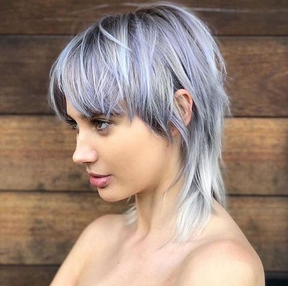 Side view of a lady wearing the Classic Wolf Cut for Women
