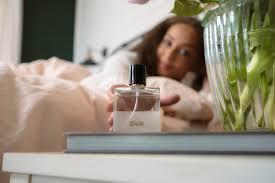 A woman reaches for her favourite perfume to start her day off right.
