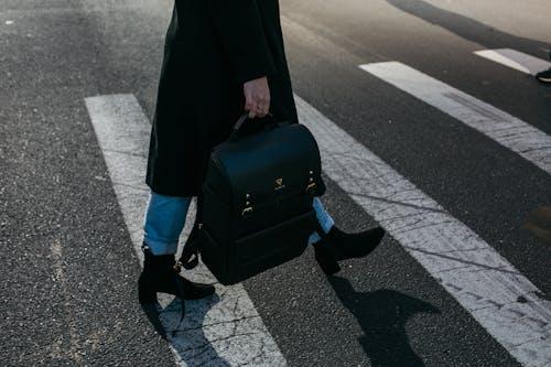 Free Person Carrying Bag Walking on Pedestrian Lane Stock Photo