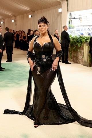 Image may contain Ashley Graham Clothing Costume Person Dress Formal Wear Adult Footwear Shoe Fashion and Car