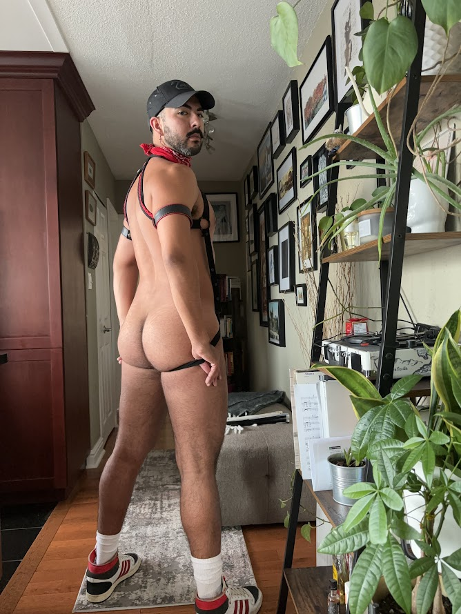 Phil posing in fetish jockstrap outfir with suspenders showing off his gay hairy bubble butt in iphone selfie