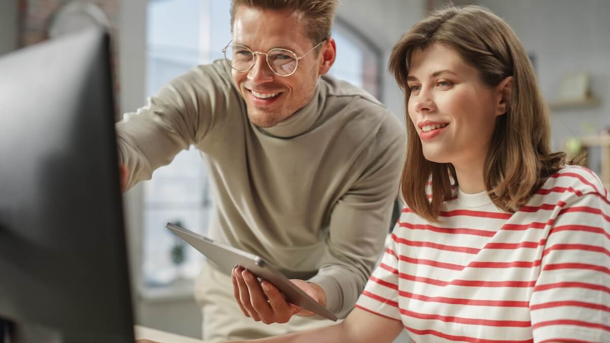 Colleagues using a computer