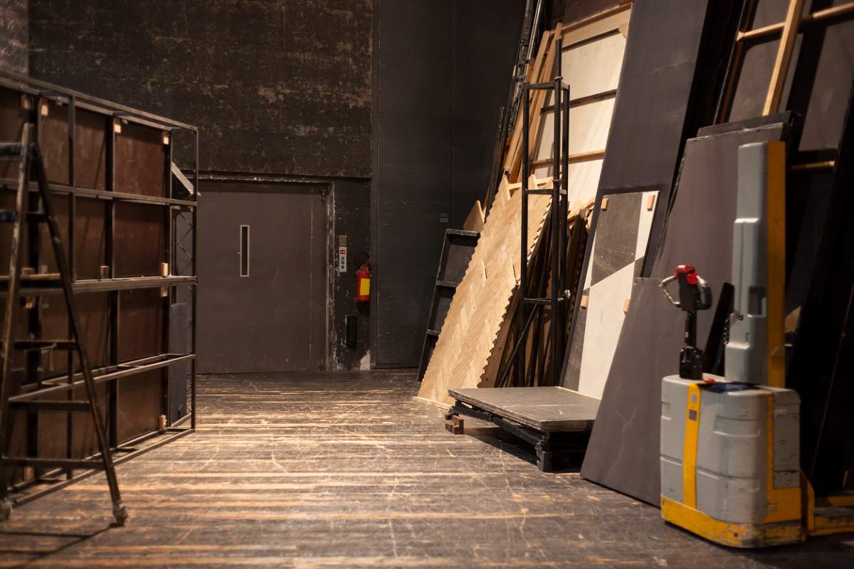 A view of the backstage storage space of a theater production.