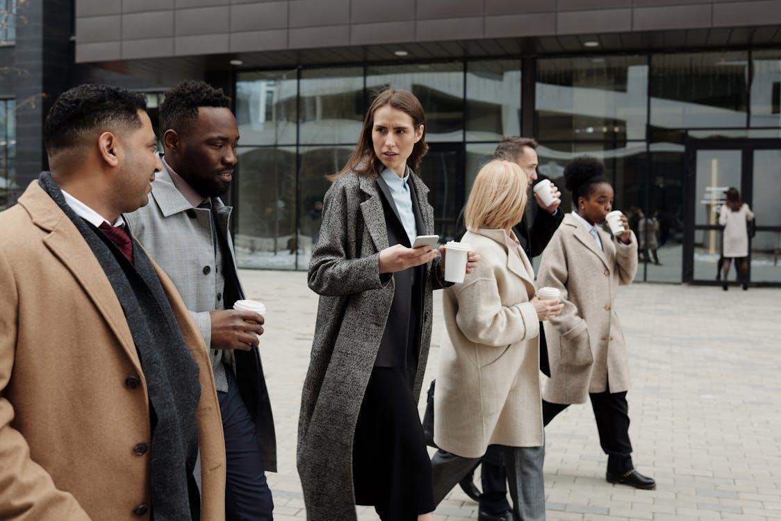 Free Business People taking a Coffee Break and Talking Stock Photo