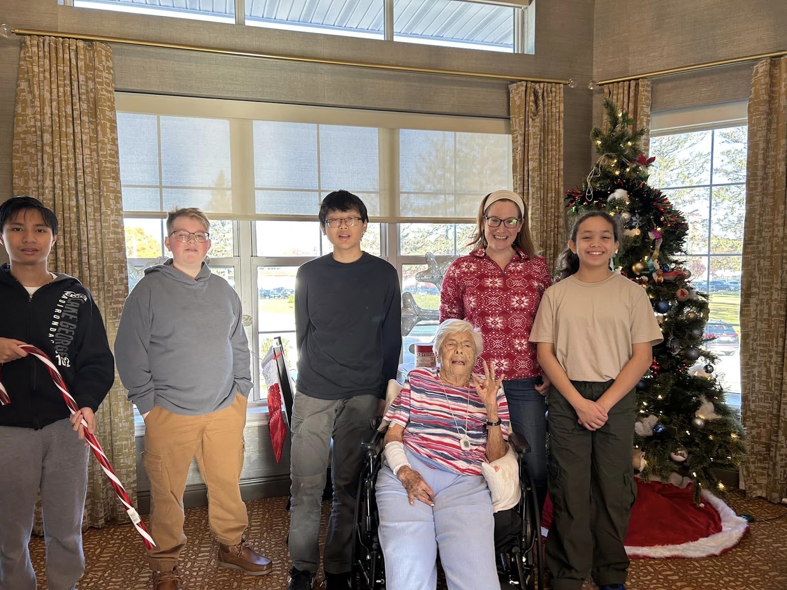 The costs of in-home dementia care on display with smiling people in front of a Christmas tree