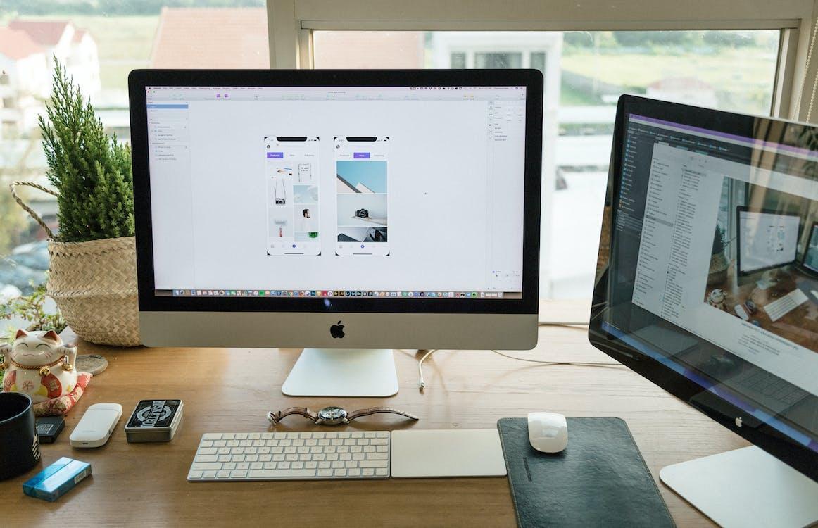 Free Apple Imac on Brown Wooden Desk Stock Photo