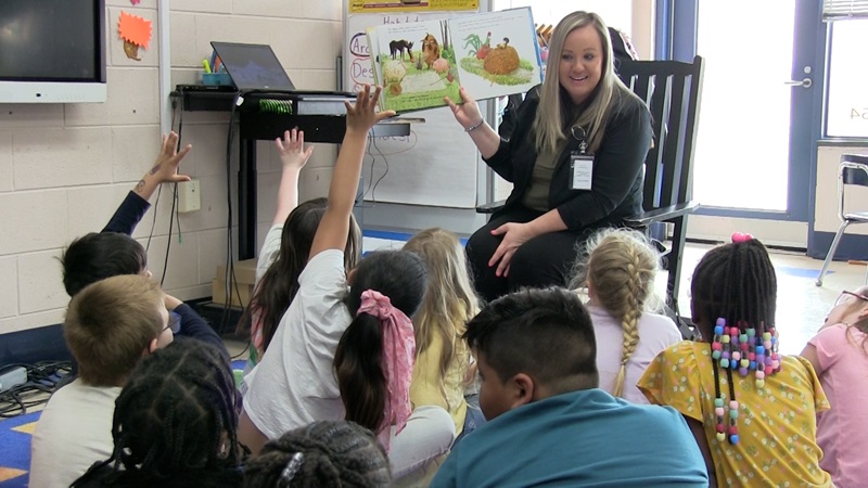 Casey Jackson reads to students at Aycock Elementary.