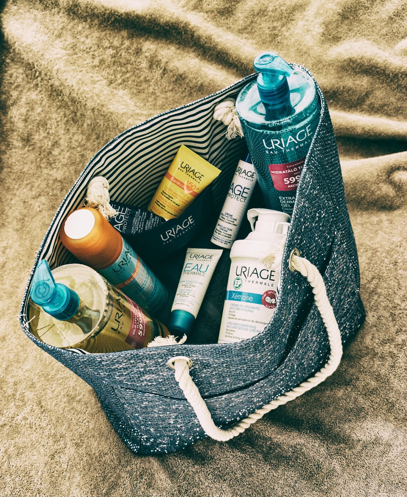 A bag carrying routine travel essential skincare and haircare products.