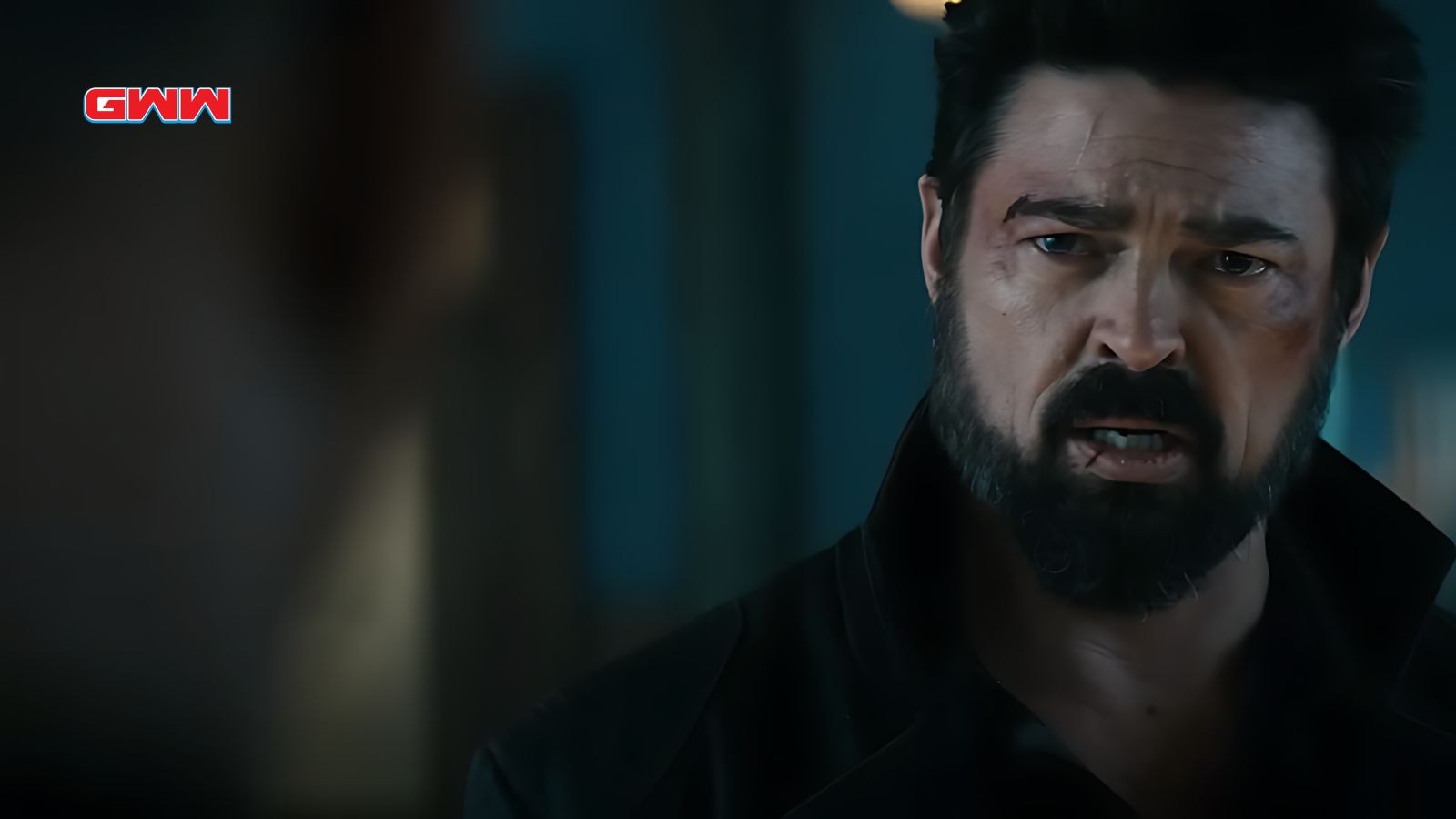 Karl Urban as Billy Butcher, stern expression, slightly bruised face.