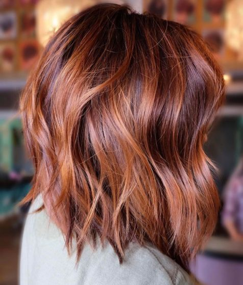 Side view of a lady wearing the balayage lob