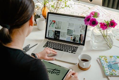 Free Photo Of Person Using Laptop For Graphic Designs  Stock Photo