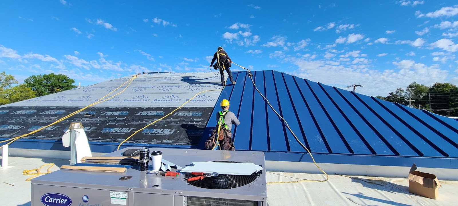 Metal roof installation on a commercial property