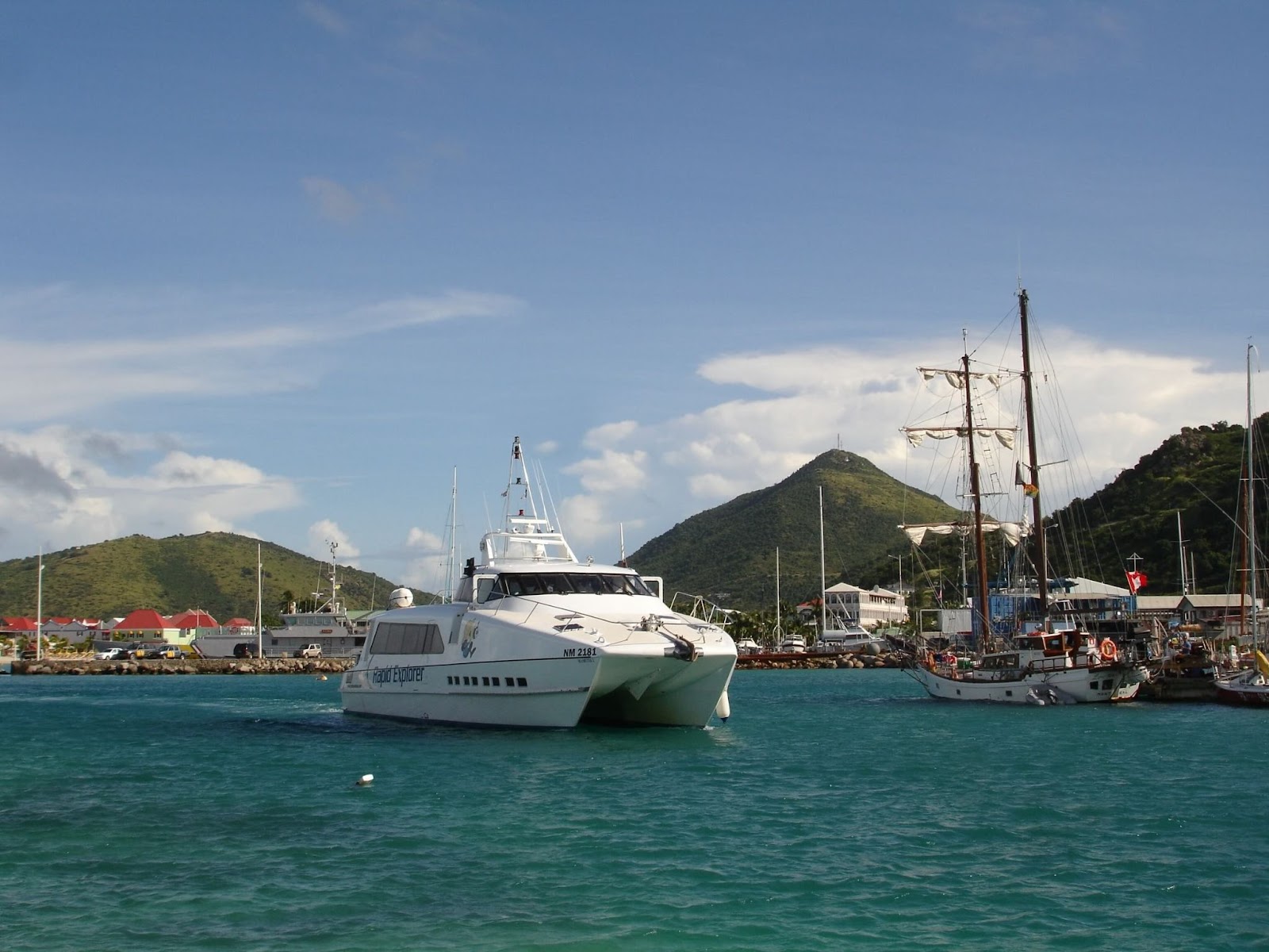 A white ferry in the beach in Sint Marteen which is one of the safest Caribbean islanfds.