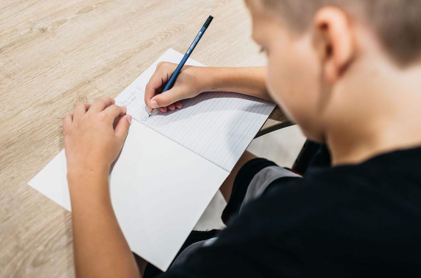 A child writing with dyslexia