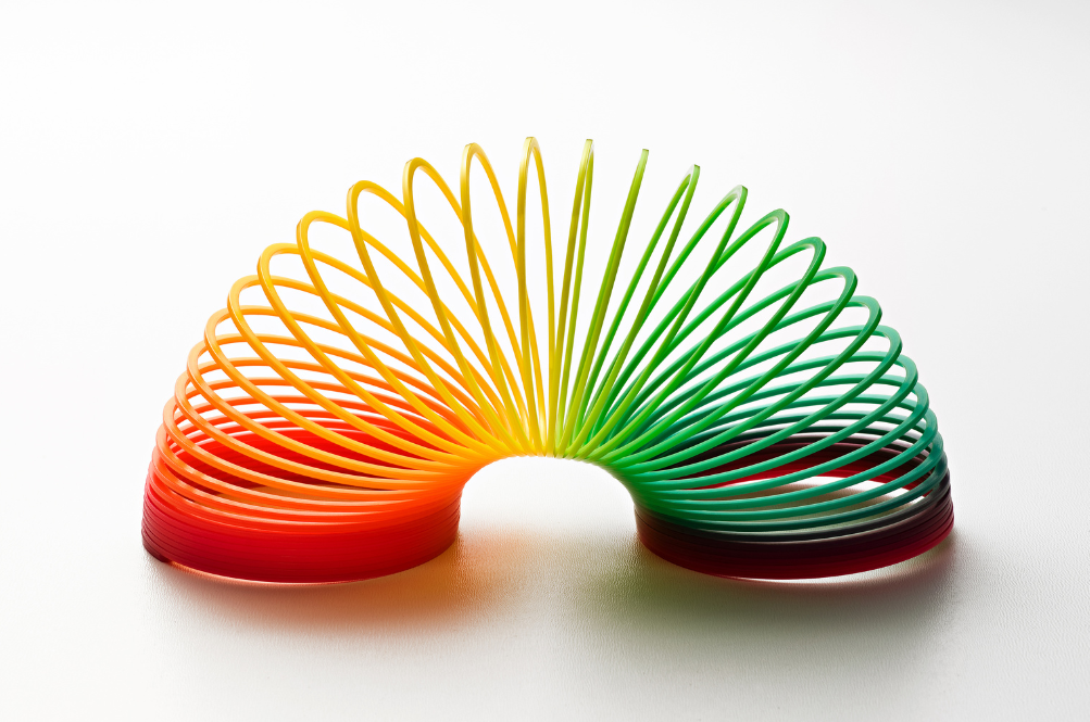 Photo of a multi-colored slinky, demonstrating the flexibility of a monthly development budget for your FileMaker solution.