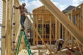 A person on a ladder in a construction site

Description automatically generated