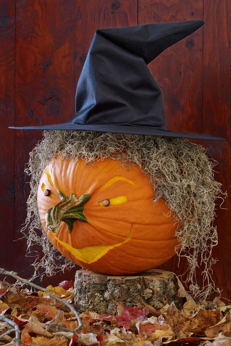 pumpkin carving ideas, pumpkin wearing a black pointy hat and carved like a witch