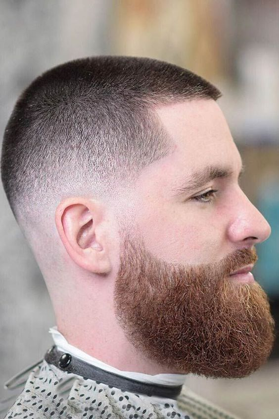 Side view of a guy wearing the Short Buzz Cut Fade with Beard