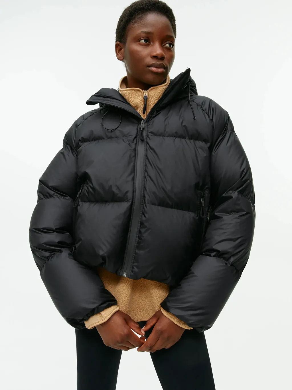 a model wearing a puffer jacket for cold weather outfits