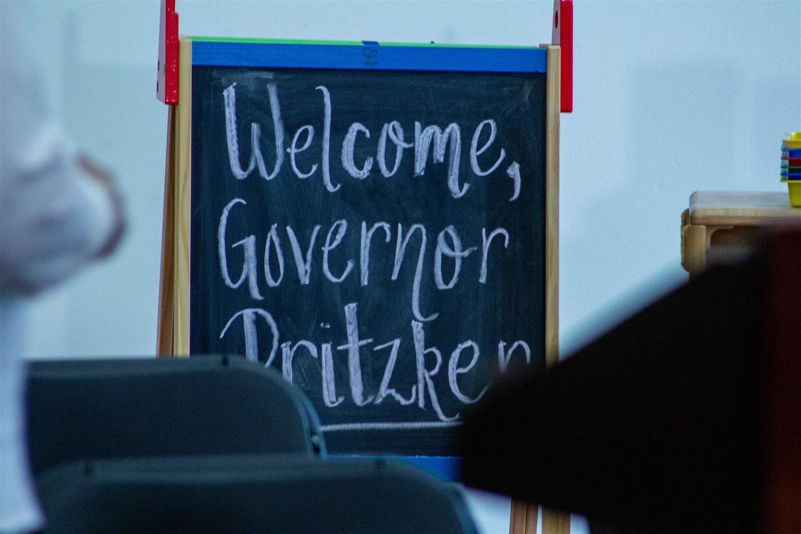A chalkboard welcome sign for Gov. JB Pritzker