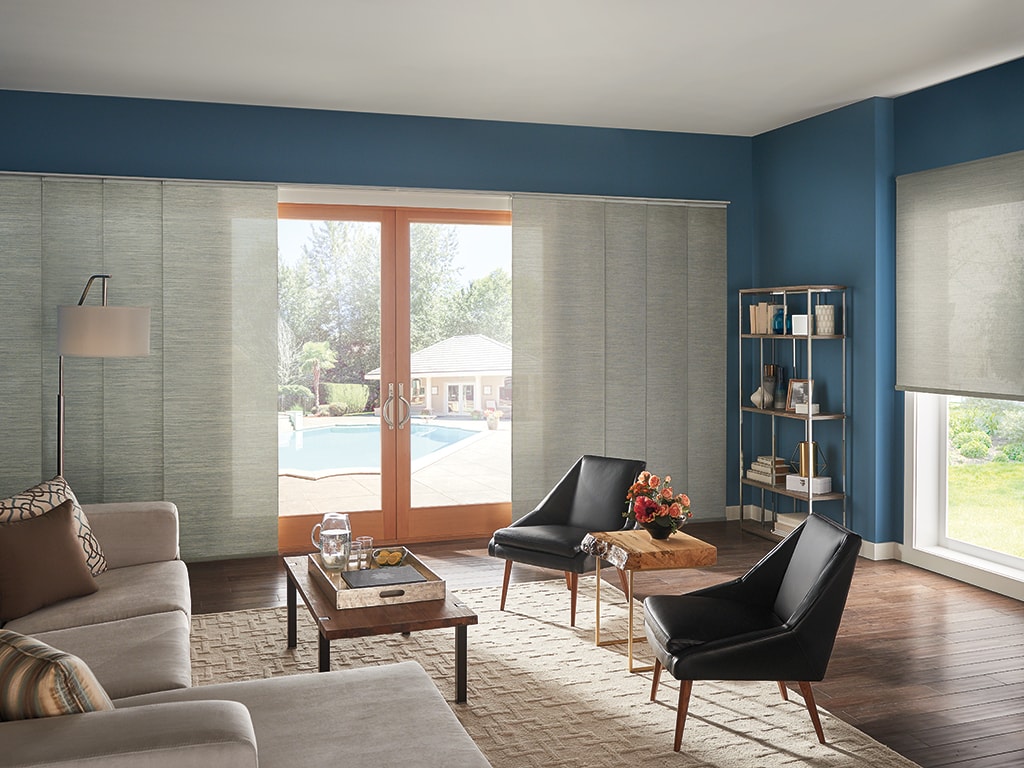 Vertical blinds in blue room with multiple chairs