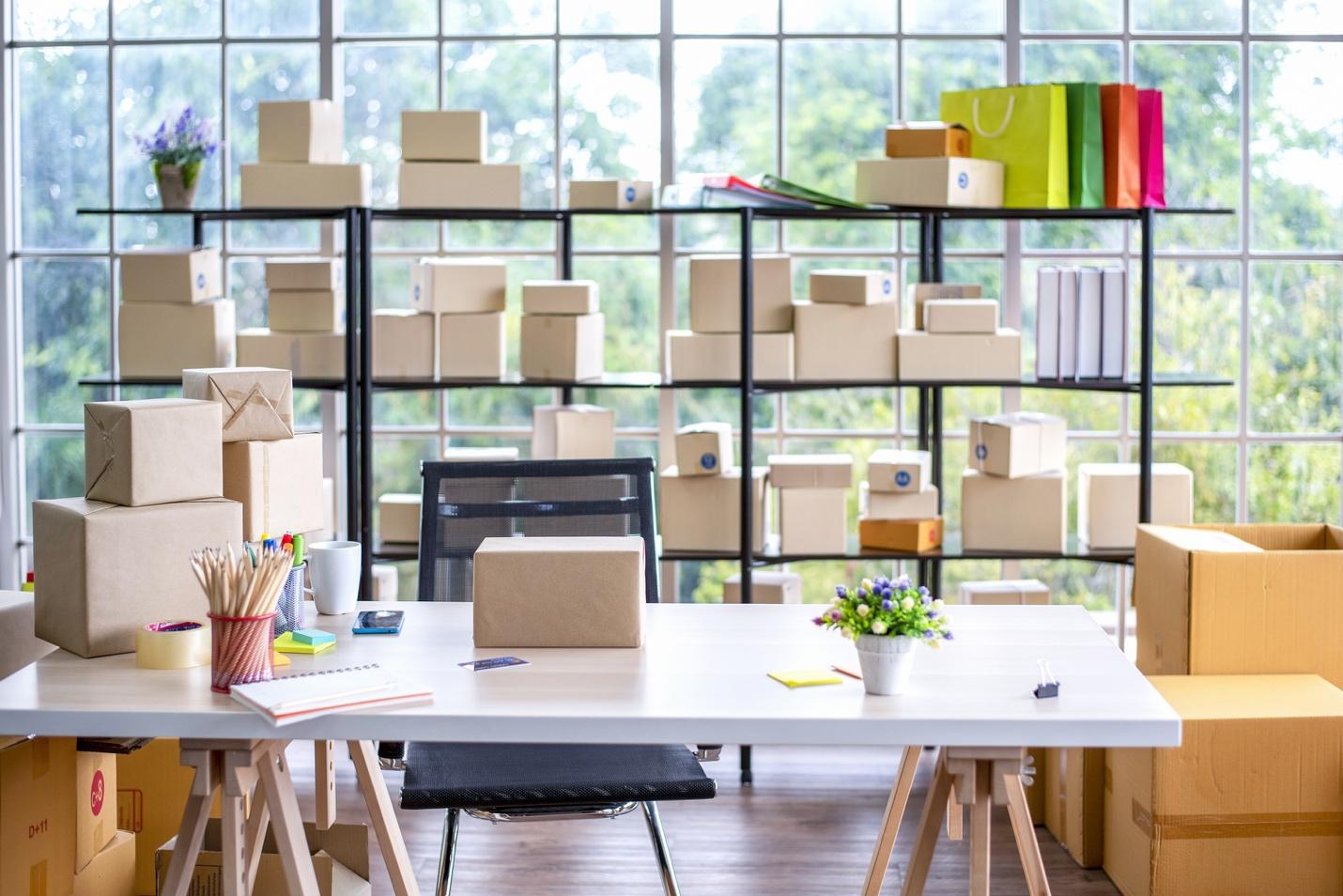 Shelf filled with packed boxes and shopping bags