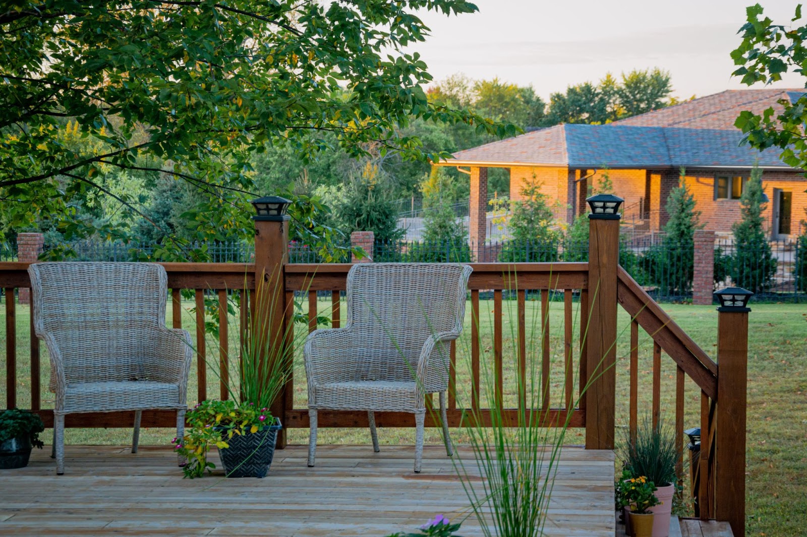 A shot of a scenic view of a patio with comfortable chairs. 