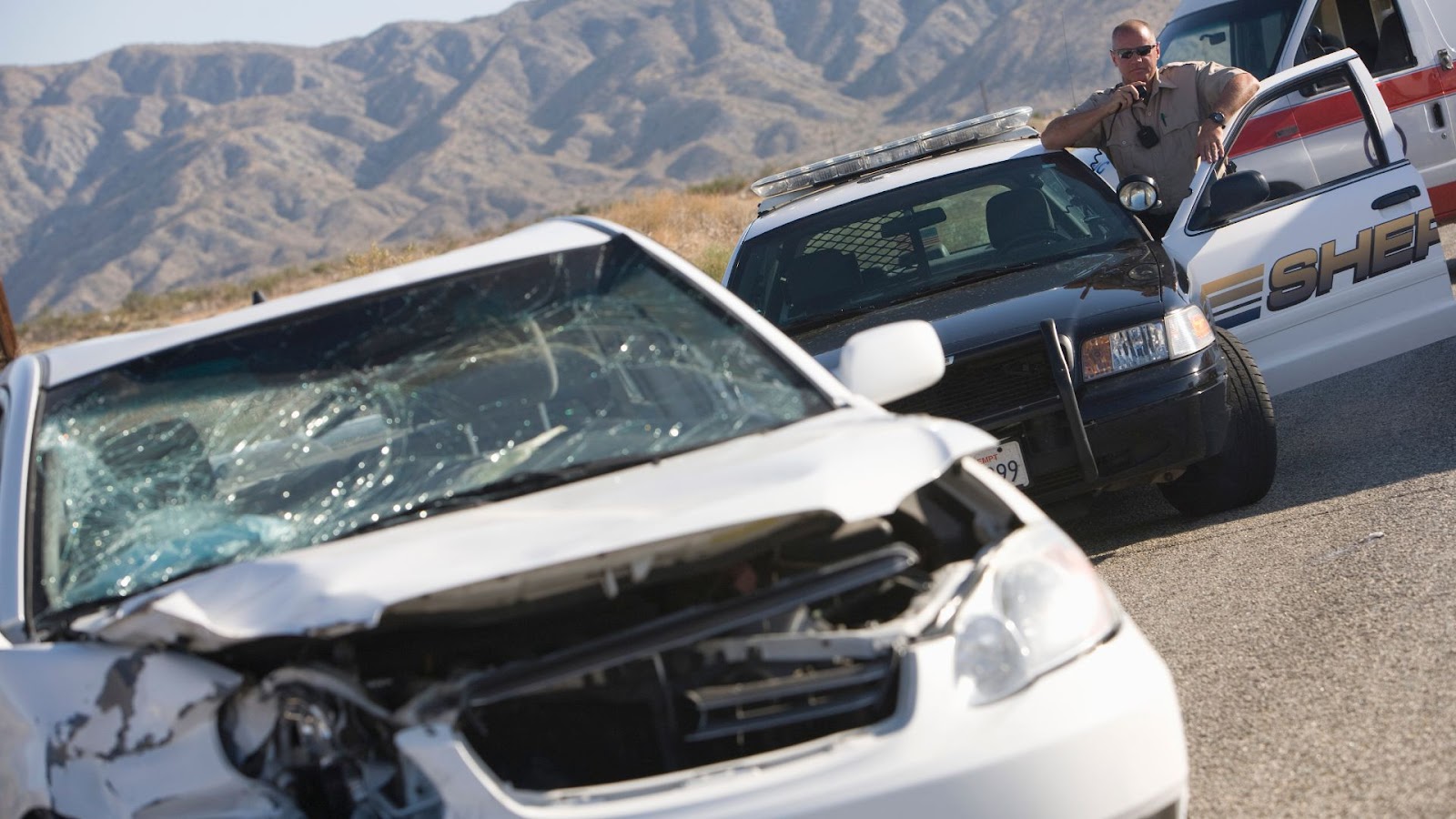 policeman at a car accident site