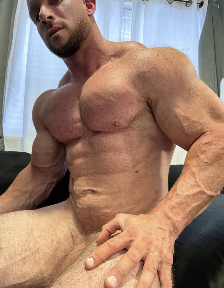 Cody Mac naked showing off his flaccid cock and hard muscled chest and abs
