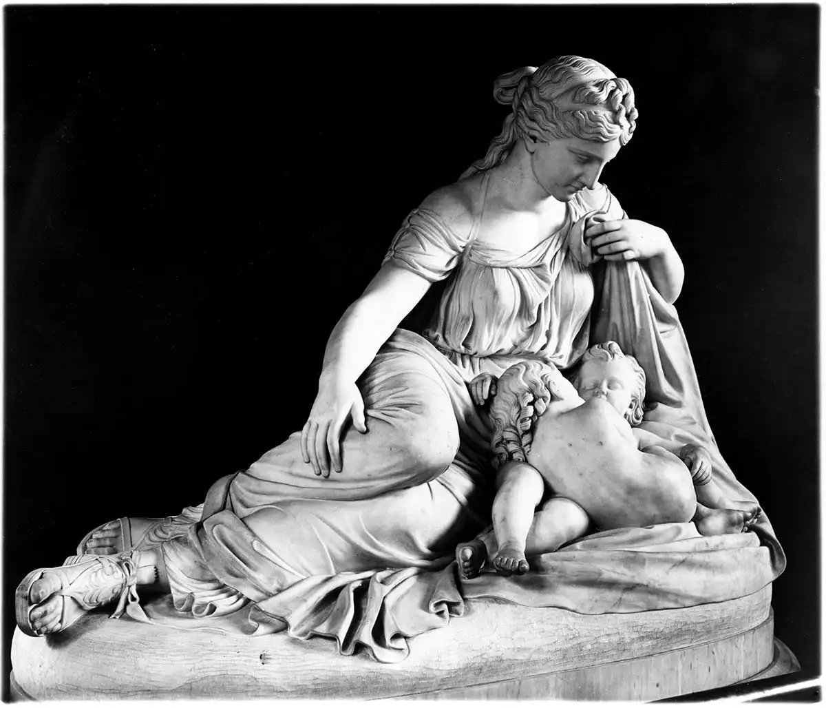 This is a sculpture of Leto (the mother of Artemis and Apollo) lying on her side as she looks down at her twins. 