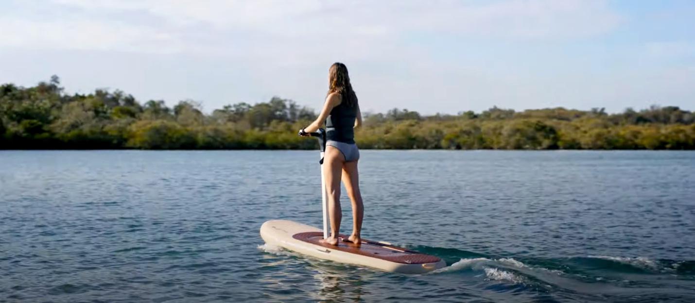 A person on a paddle board

Description automatically generated