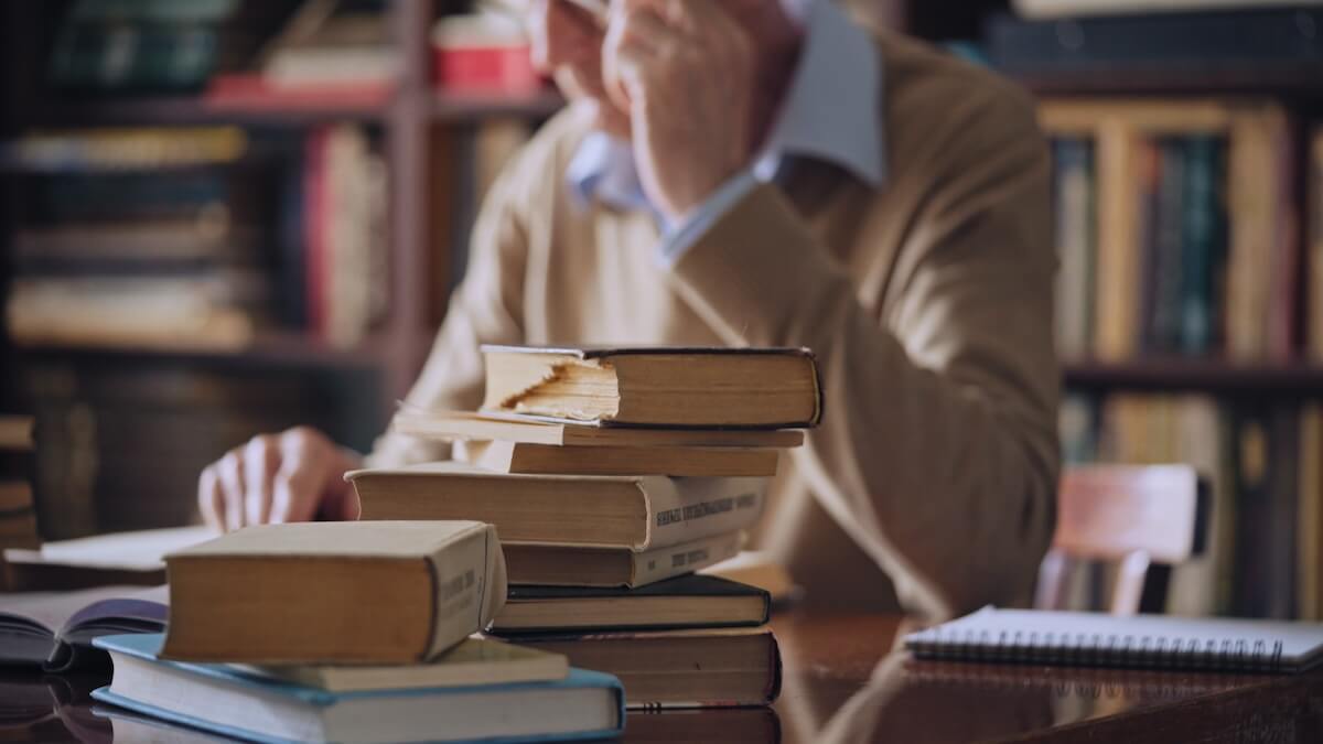 Sabbatical leave: stack of books on a desk