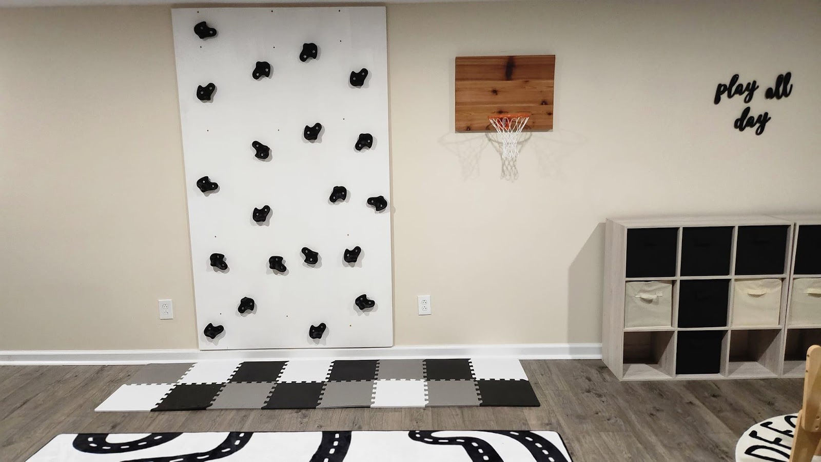 A room with a wall and a basketball hoopDescription automatically generated