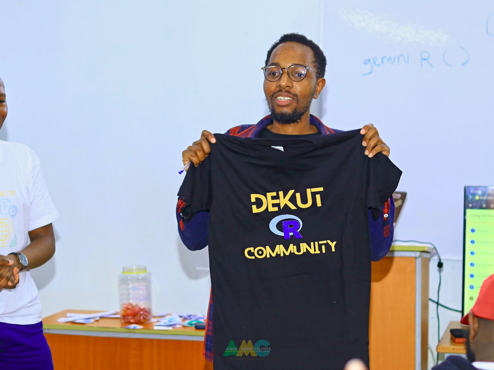 awarding participants with our community swag during build with AI event in collaboration with Google students developer group April 2024