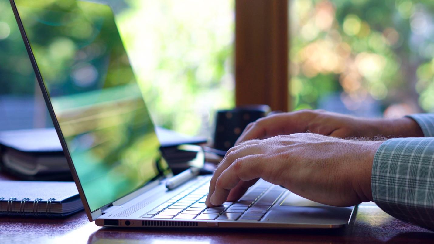 Person typing on laptop