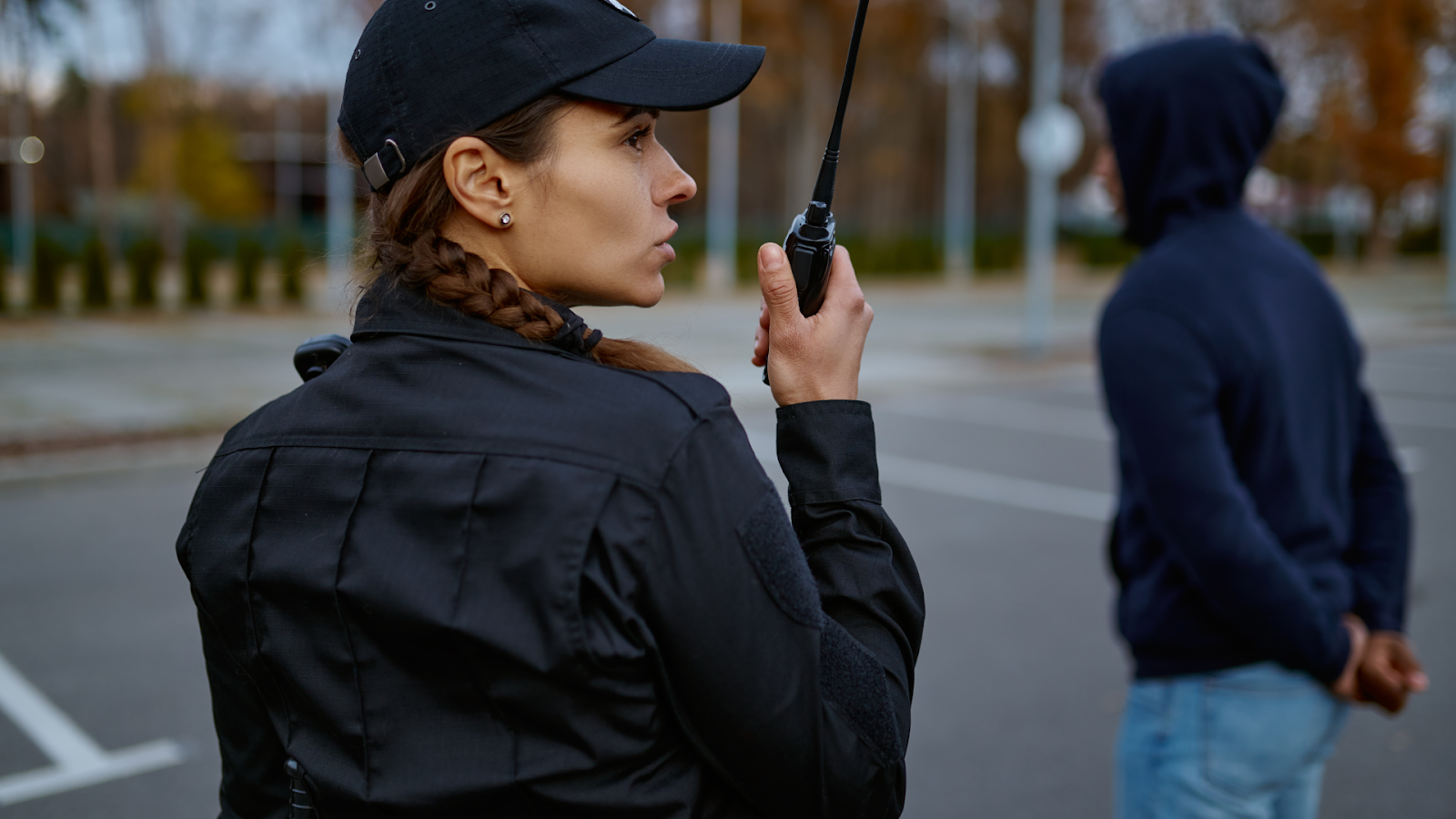 (police officer talking on her radio)