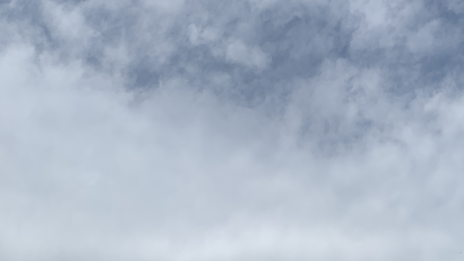 A dull fuzzy sky with clouds that look like dryer lint