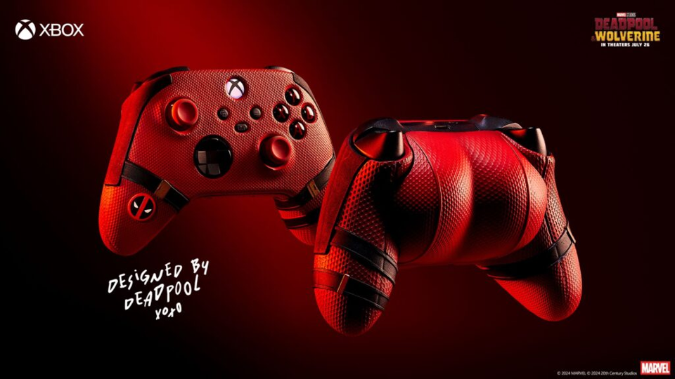 A promo image for an Xbox Controller “designed by Deadpool.” The controller is the color and texture of Deadpool’s costume with straps on the sides like the ones on his legs. The back of the controller has more mass to it than a regular controller, it looks like a butt. The whole thing looks like you are grabbing Deadpool’s butt if you use this controller.  