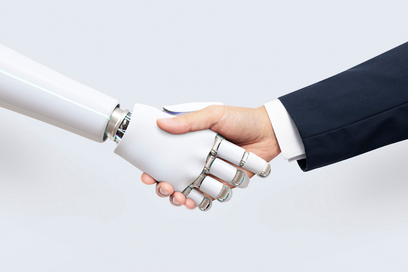 A human and robot shaking hands