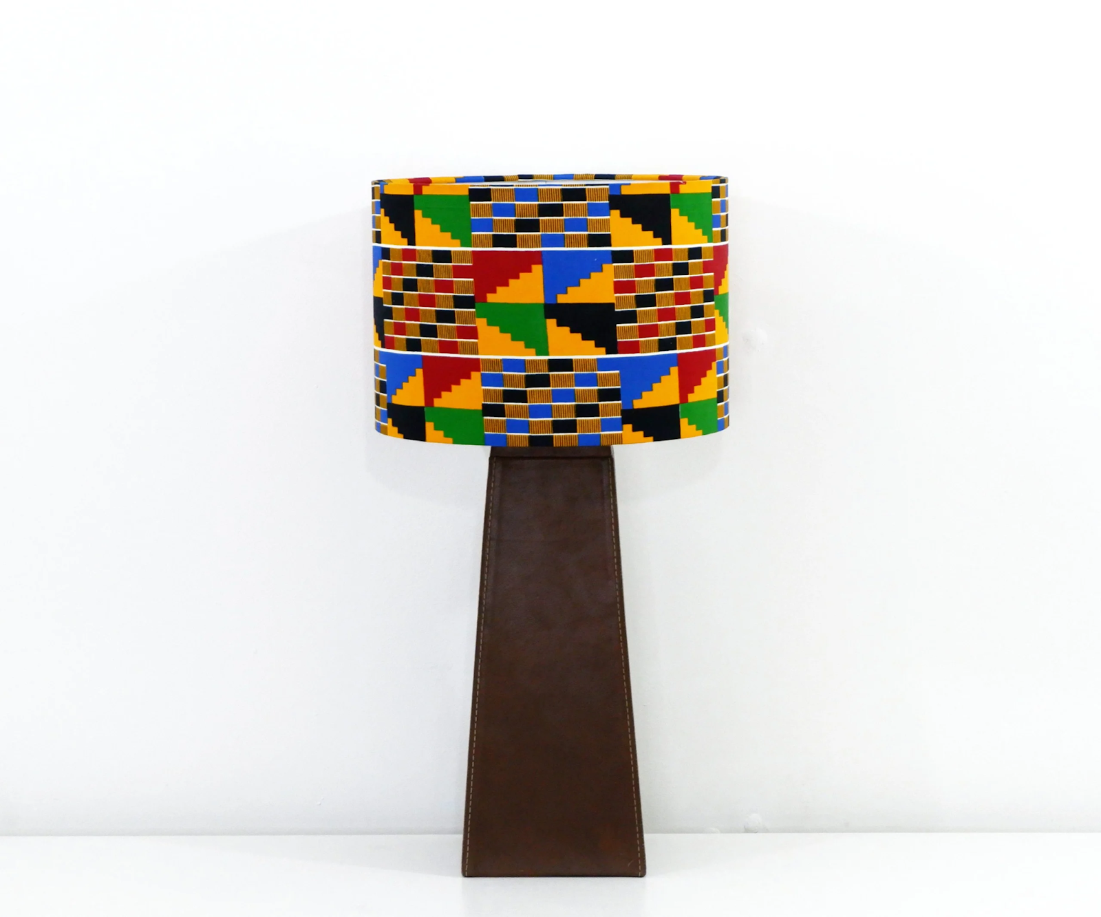 Table lamp with a Kente-inspired lampshade