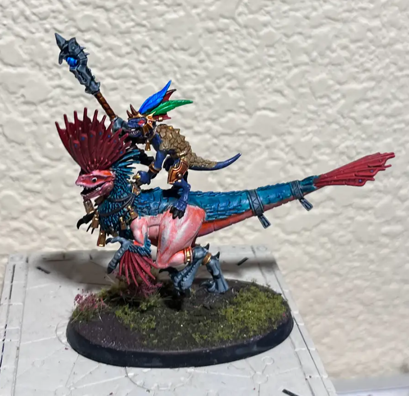 A toy figurine of a person riding a dragon Description automatically generated