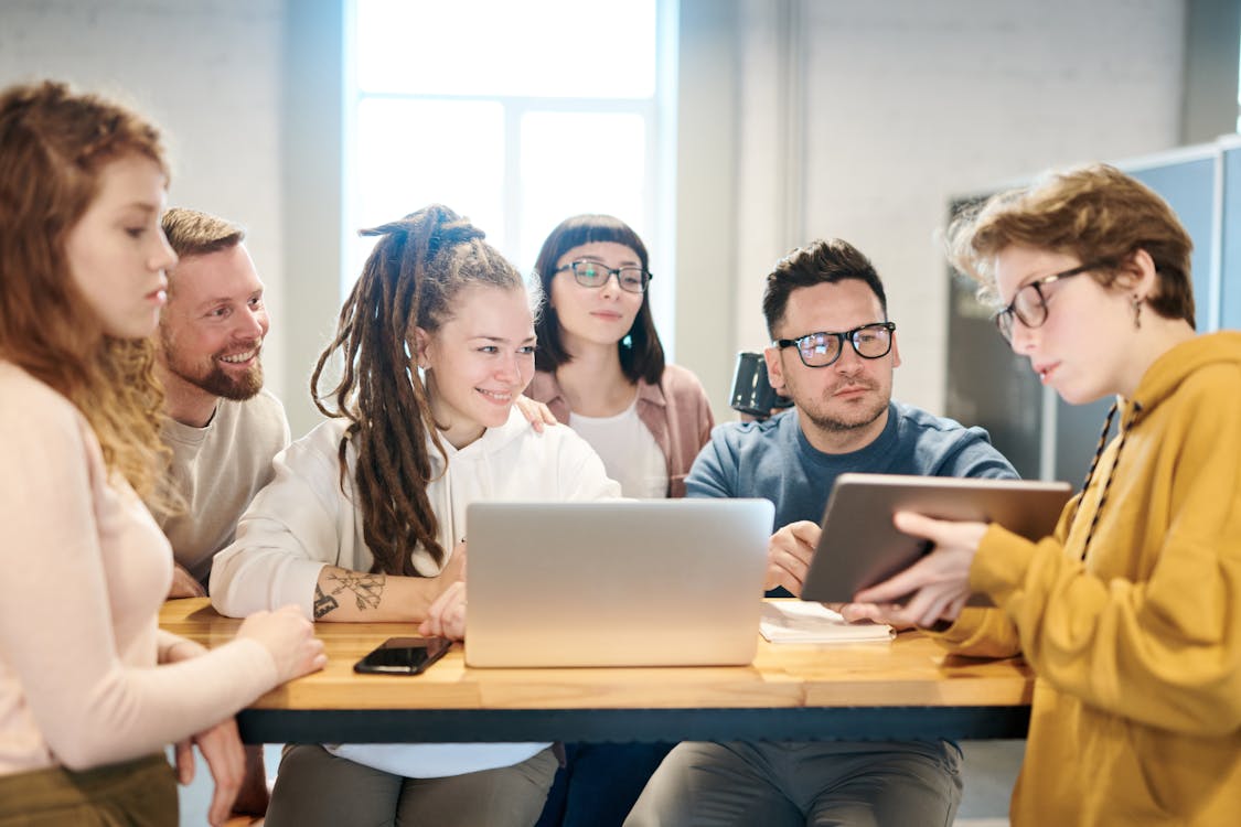 Free Photo Of People Looking On Tablet Stock Photo