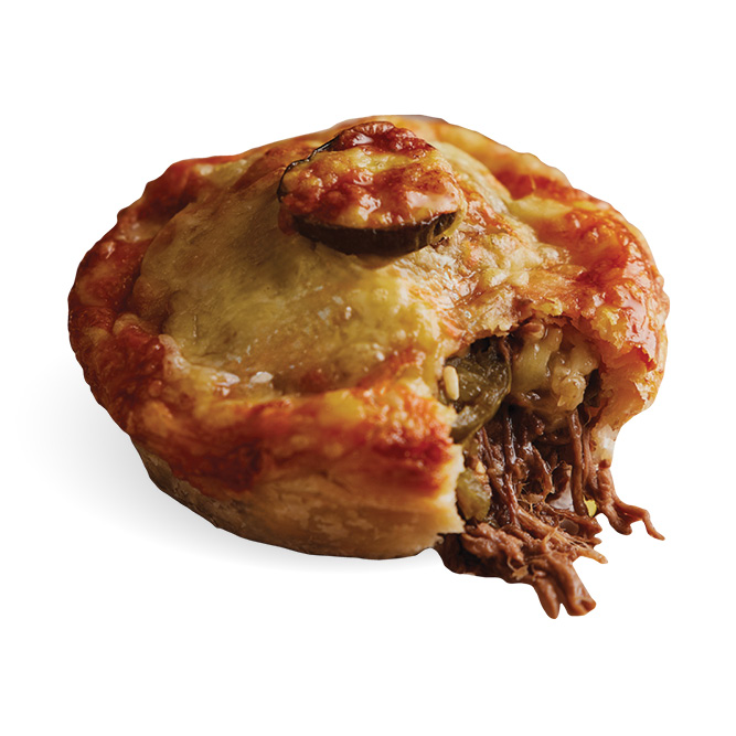 A Banjo's Pulled Beef Brisket Pie with a bite out of it showing the inside ingredients 