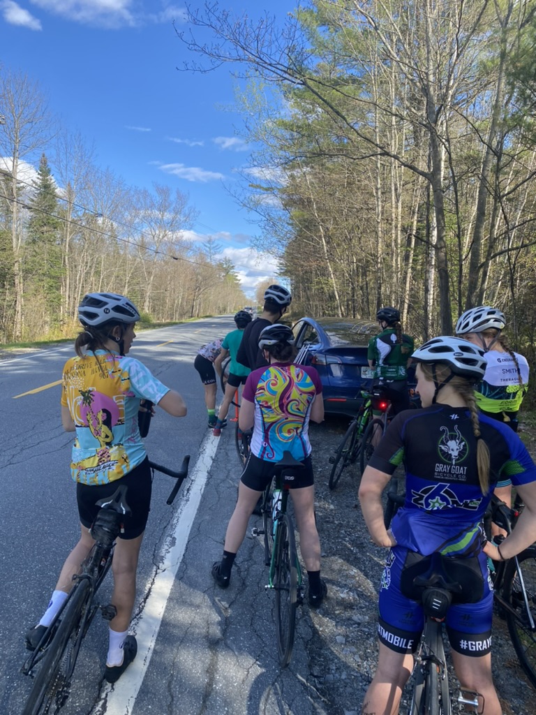 Dartmouth students take a roadside break during a bike ride to Moosilauke Ravine Lodge.