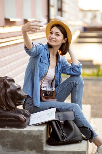 Stylish tourist taking selfie on holiday